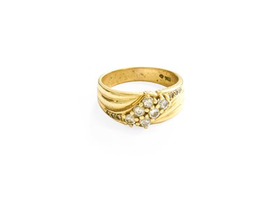 Lot 181 - A Diamond Crossover Ring, the round brilliant...