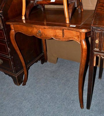 Lot 462 - A French style walnut occasional table with single drawer and shaped top