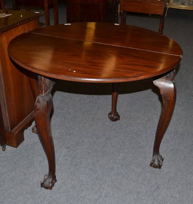 Lot 466 - A Georgian mahogany D-shaped fold over tea table