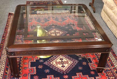 Lot 1387 - A Glass Top Coffee Table, with blind fretwork...