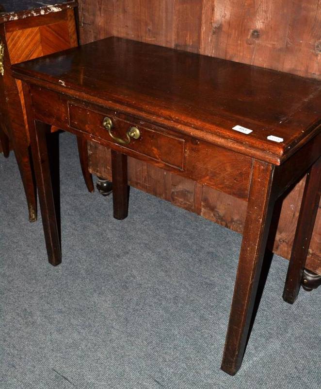 Lot 483 - A Georgian mahogany fold over tea table with single drawer