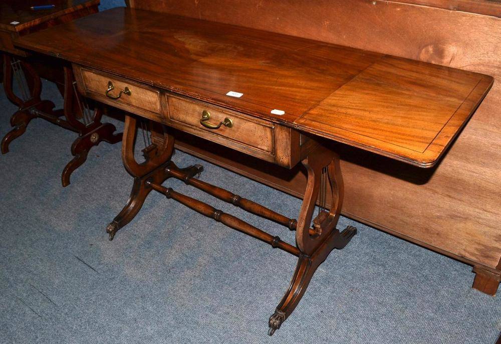 Lot 485 - An early 20th century sofa table with two drawers