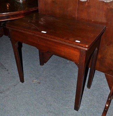 Lot 487 - A 19th century mahogany fold over tea table