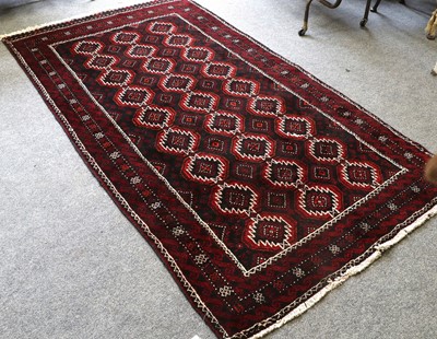 Lot 1165A - Baluch Rug, the midnight blue field with three...