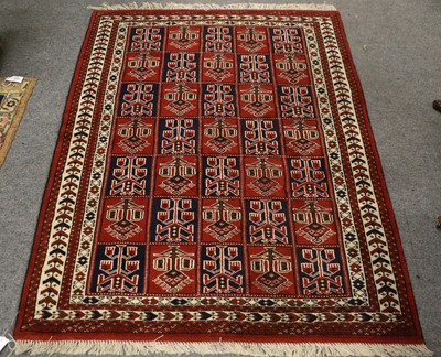 Lot 1156 - "Bukhara" Rug, the compartmentalised field of...