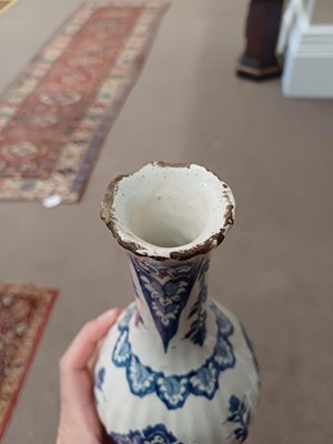 Lot 571 - A Delft Bottle Vase, circa 1700, of fluted...
