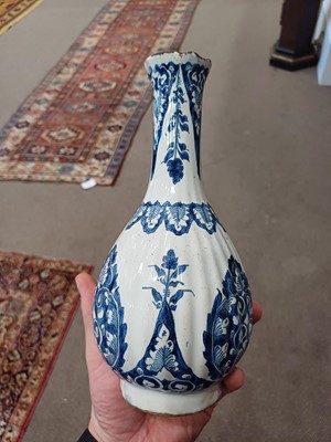Lot 571 - A Delft Bottle Vase, circa 1700, of fluted...