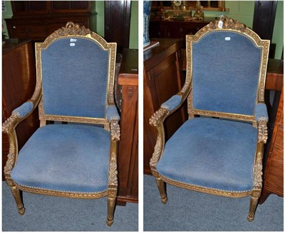Lot 490 - Pair of modern gilt framed open armchairs with blue and gilt upholstery
