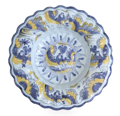 Lot 573 - A Delft Bukkel Platte, circa 1700, painted in...