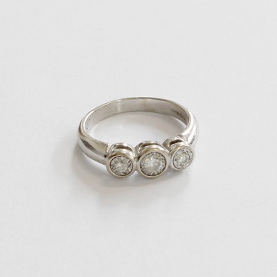 Lot 193 - An 18 Carat Gold Diamond Three Stone Ring, the...