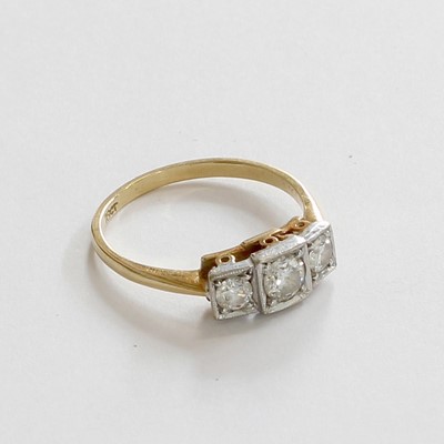 Lot 229 - A Diamond Three Stone Ring, the graduated...