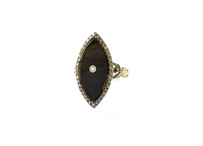 Lot 372 - An Onyx and Diamond Navette Cluster Ring, the...