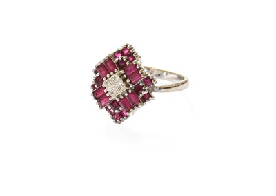 Lot 383 - A Ruby and Diamond Cluster Ring, four round...