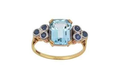 Lot 2284 - A Blue Topaz and Sapphire Ring the emerald-cut...