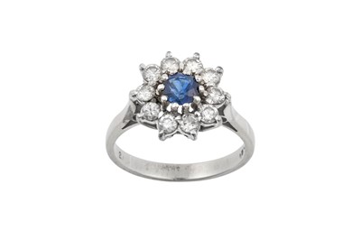 Lot 2270 - A Sapphire and Diamond Cluster Ring the round...