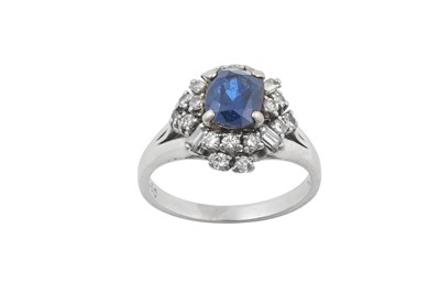 Lot 2271 - A Sapphire and Diamond Cluster Ring the oval...