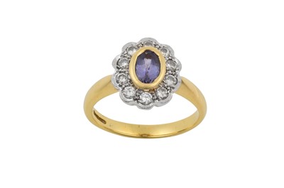 Lot 2306 - An 18 Carat Gold Tanzanite and Diamond Cluster...