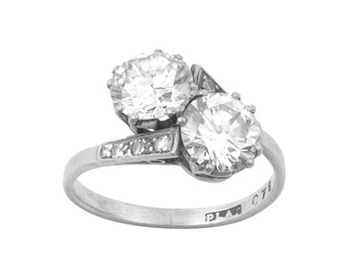 Lot 2192 - A Diamond Two Stone Twist Ring the round...