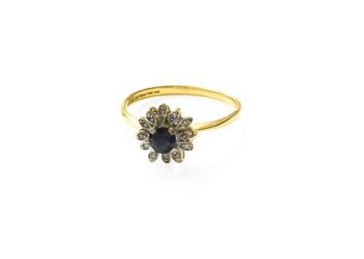 Lot 375 - A Sapphire and Diamond Cluster Ring, of flower...