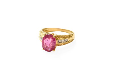 Lot 352 - An 18 Carat Gold Red Stone and Diamond Ring,...