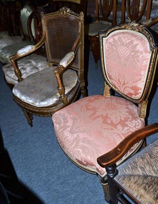 Lot 520 - An ebonised and gilt painted shield back dining chair and a French style gilt open armchair...