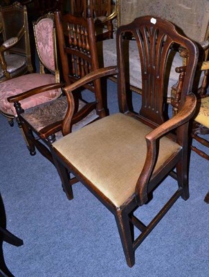 Lot 521 - A mahogany framed elbow chair and an elm country armchair with rush seat (2)