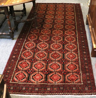 Lot 1180 - Baluch Rug, the compartmentalised field with...