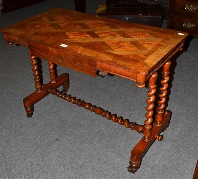 Lot 531 - A Victorian walnut inlaid side table on a turned stretcher base