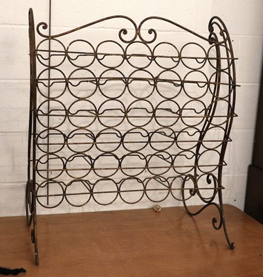 Lot 1434 - A Wrought Metal Wine Rack, with scroll ends,...