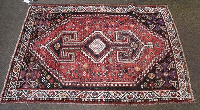 Lot 1170 - Kashgai Rug, the stepped raspberry lozenge...