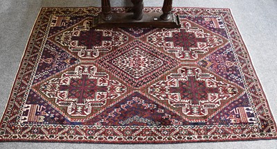 Lot 1142 - Afshar Rug, the indigo diamond lattice field...