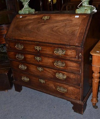 Lot 534 - A Georgian mahogany bureau