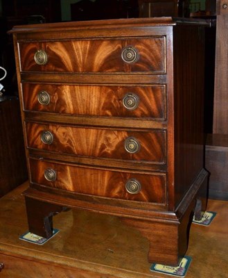 Lot 536 - A small reproduction mahogany four height chest of drawers