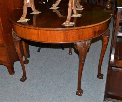 Lot 542 - A mahogany D-shaped fold over tea table