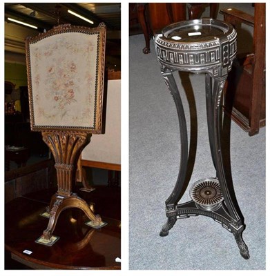 Lot 543 - A gilt framed firescreen on tripod base with a woolwork insert and an ebonised plant stand