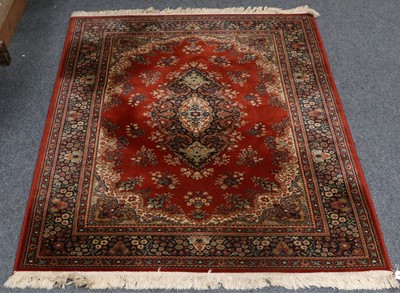 Lot 1171 - A Machine Made Rug of Oriental Design, the...