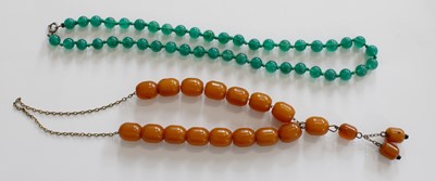 Lot 244 - An Amber Bead Necklace, drop length 7cm,...