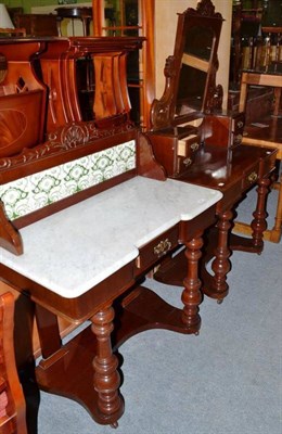 Lot 565 - A late Victorian mahogany dressing table with matching washstand with marble top and tiled back