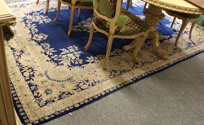 Lot 1147 - Kirman Carpet, the royal blue field centred by...