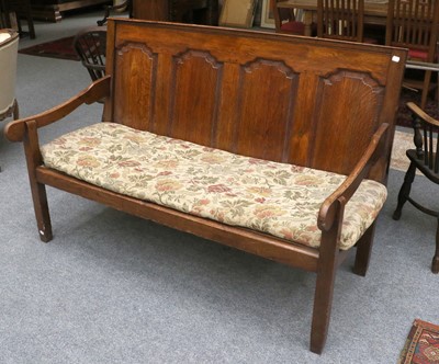 Lot 1414 - An Early 19th Century Oak Four Panel Settle,...