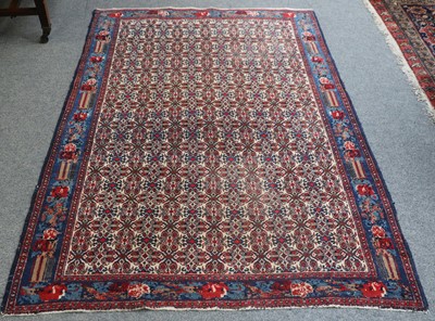 Lot 1143 - Senneh Rug, The ivory field with an all over...