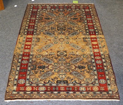 Lot 1146 - Caucasian Design Rug, The camel field with two...