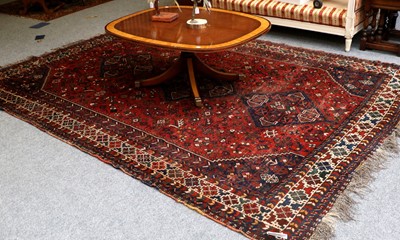 Lot 1148 - Kashgai Carpet, The madder field with three...