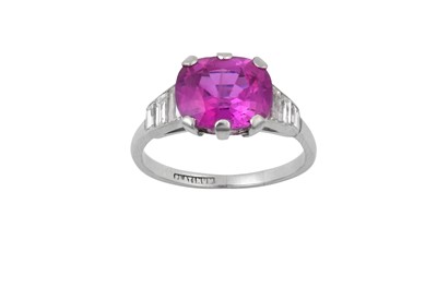 Lot 2274 - A Pink Sapphire and Diamond Ring the deep pink...