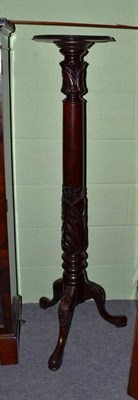 Lot 579 - A mahogany torchere