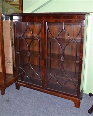 Lot 580 - A mahogany two door glazed bookcase