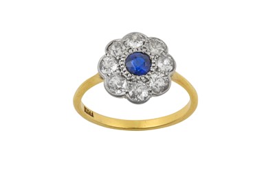 Lot 2305 - A Sapphire and Diamond Cluster Ring the round...