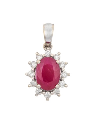 Lot 2221 - A Ruby and Diamond Pendant the oval cut ruby...