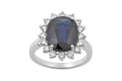 Lot 2215 - A Sapphire and Diamond Cluster Ring the...