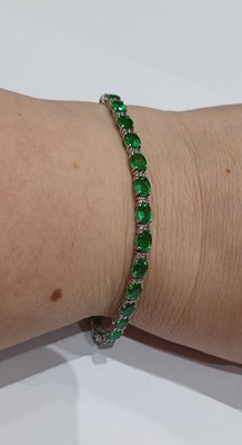 Lot 2227 - An Emerald and Diamond Bracelet the twenty-six...